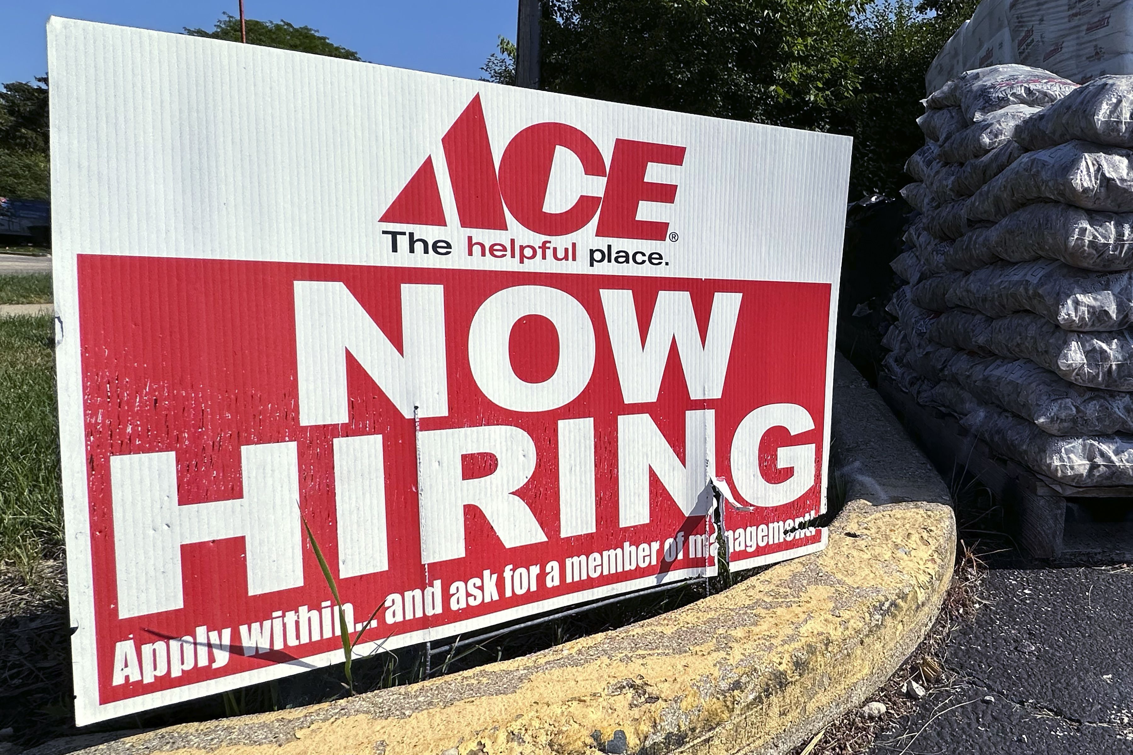 A job opening sign is displayed outside a retail store in Buffalo Grove, Ill., Sunday, July 9, 2023. (AP Photo/Nam Y. Huh)