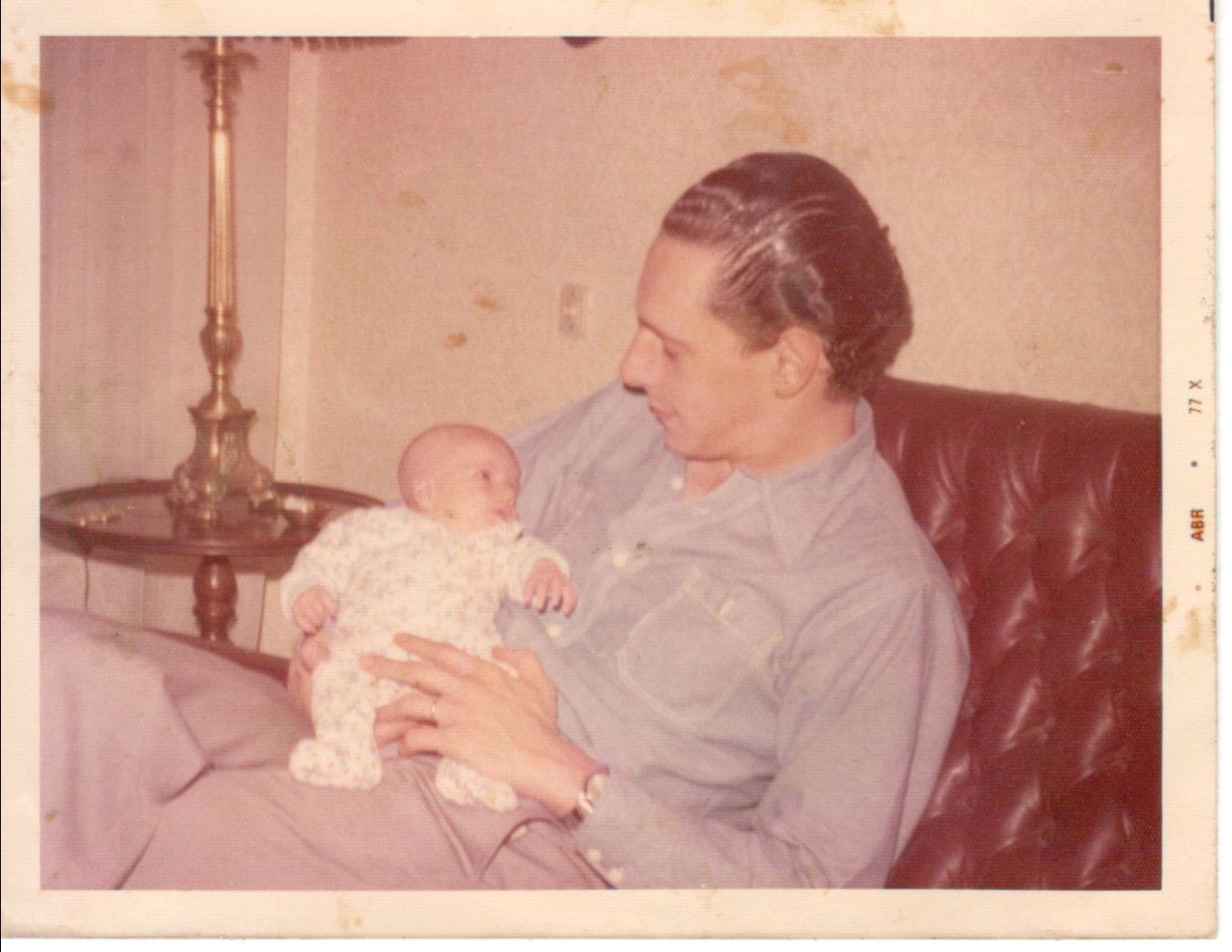In the arms of her father, Juan Manuel Abal Medina, newborn, in 1975 (Personal Archive)