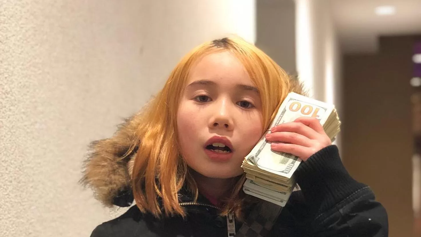 Rapper and influencer Lil Tay dies at 14
