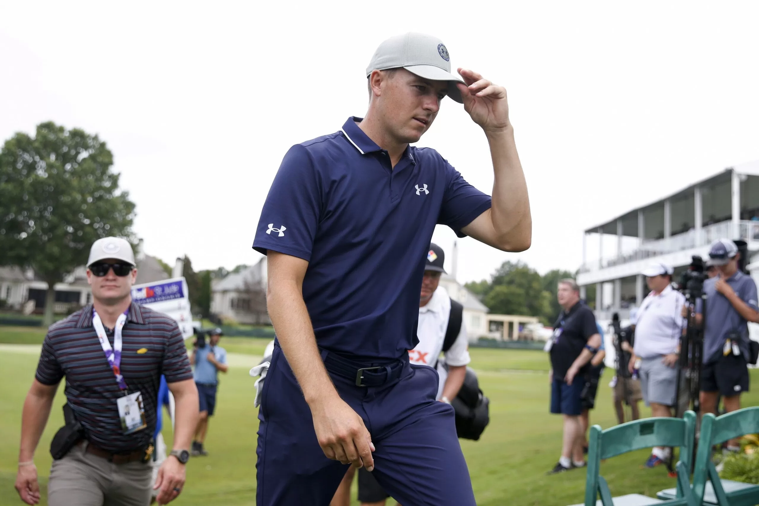 Jordan Spieth keeps a clean card in the mud for a 63 to lead the PGA Tour playoff opener
