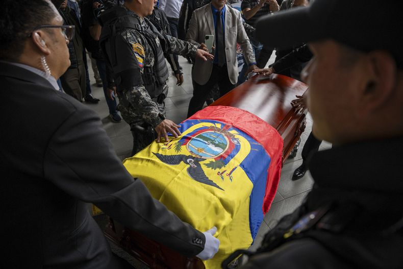 The remains of assassinated presidential candidate Fernando Villavicencio upon arrival at the Camposanto Monteolivo cemetery for burial, Friday, August 11, 2023, in Quito, Ecuador.  The 59-year-old candidate was shot dead in an electoral act on August 9, in Quito.  (AP Photo/Carlos Noriega)