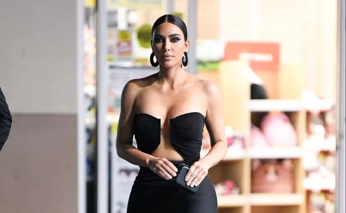 Kim Kardashian shows off her curves in a tight lace and see-through jumpsuit
