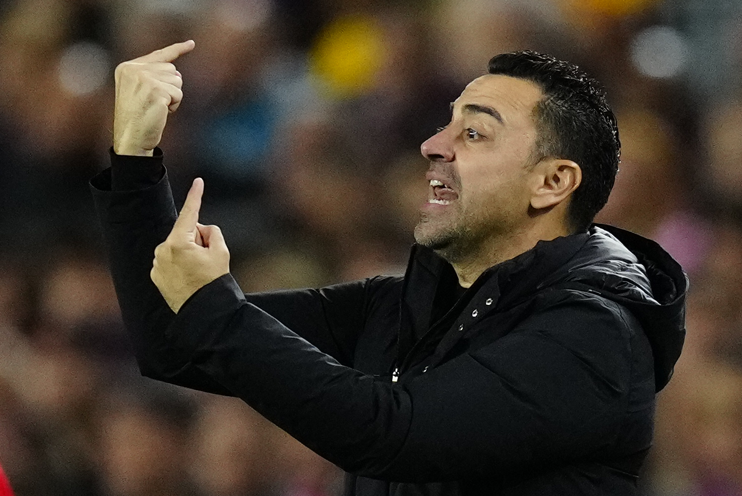 Xavi, giving instructions to his players.