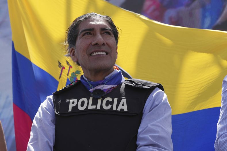Wearing a bulletproof vest, presidential hopeful Yaku Perez holds a campaign rally less than two weeks after the assassination of a candidate in Quito, Ecuador, Thursday, Aug. 17, 2023. (AP Photo/Dolores Ochoa)