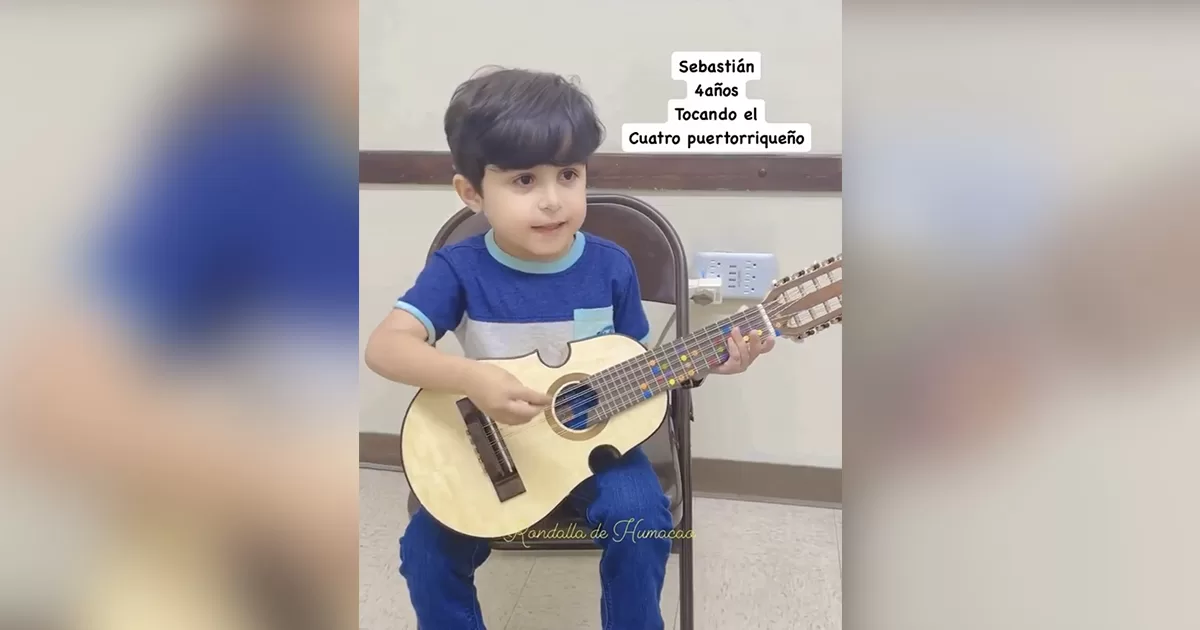 4-year-old boy thrills to play the Puerto Rican cuatro
