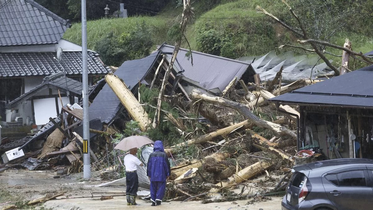 A strong tropical storm hits parts of Japan and interrupts travel in a holiday week
