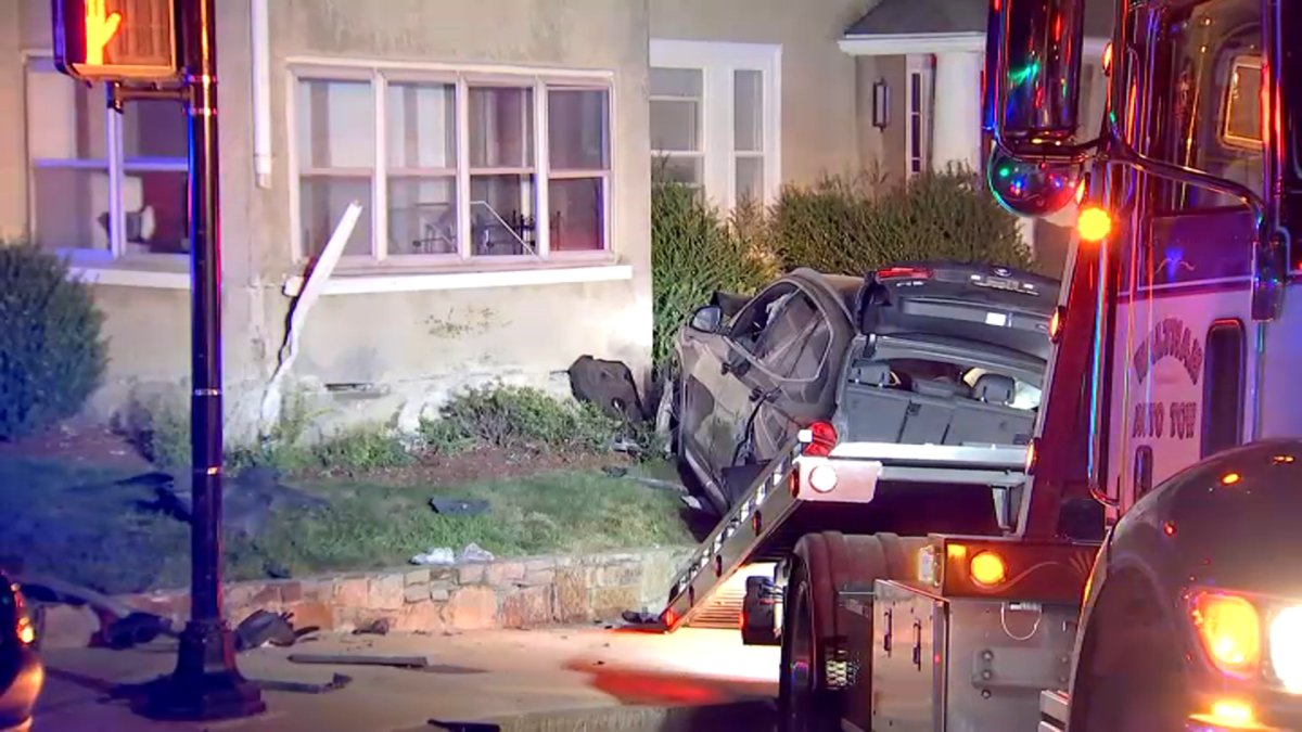 Accident ends with downed utility pole and car inside Belmont home
