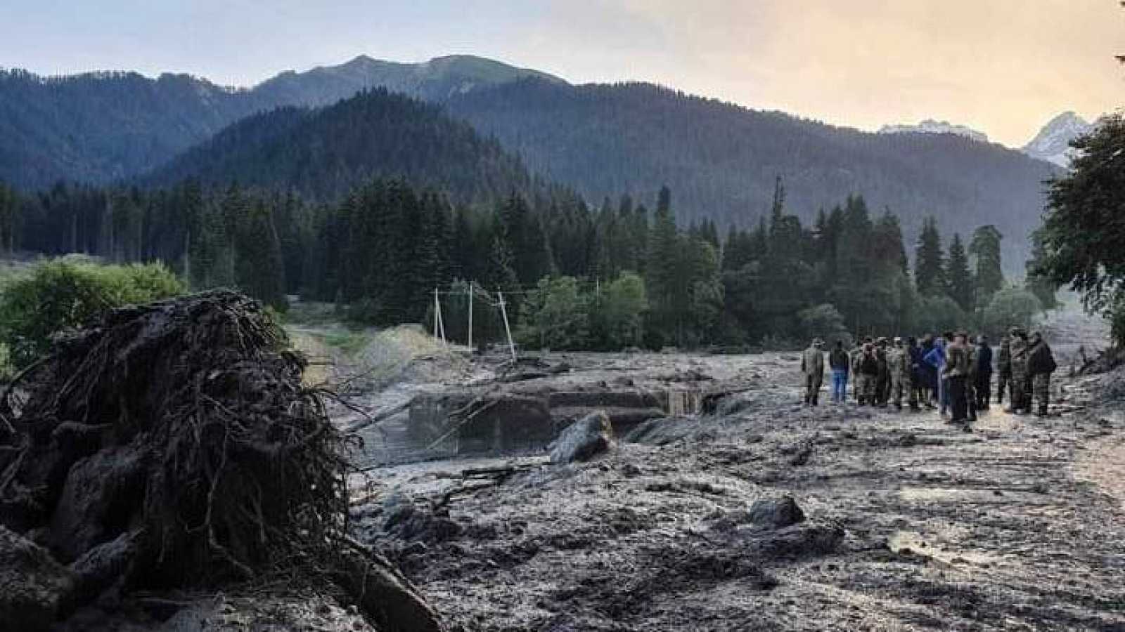 At least six dead and 31 missing from a landslide in Georgia
