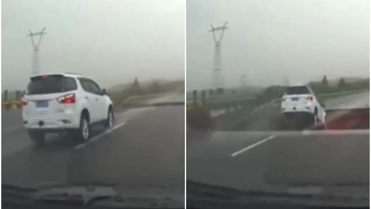 Car falls into a hole on a highway opened by heavy rains in China (video)
