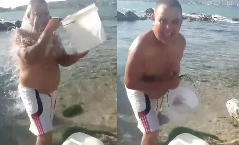 Desperation in Cuba: a man from Matanzas collects water from the beach to bathe
