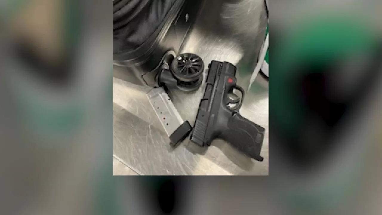 Arrested at airport for hiding gun in luggage
