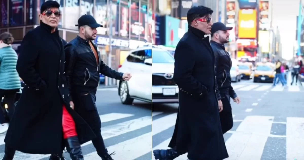 Eduardo Antonio and his partner walk through New York
