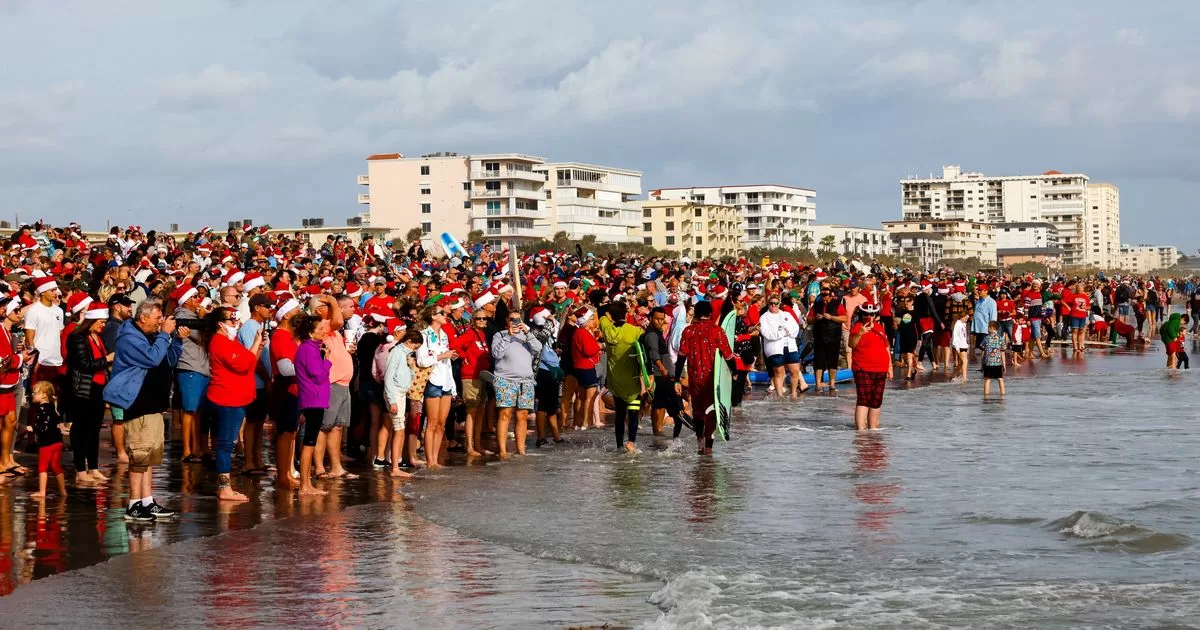 Santas surf in Florida for a noble cause
