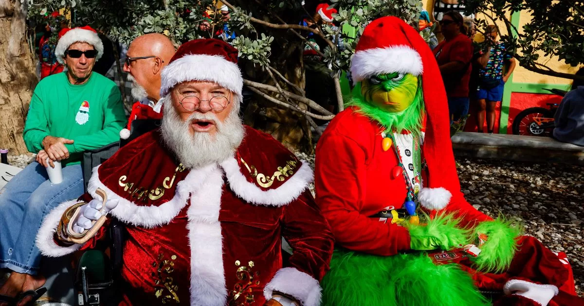 Surfers dress up as Santa Claus for a charitable cause
