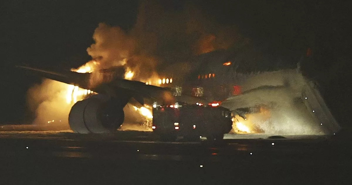 Plane catches fire on airport runway in Japan
