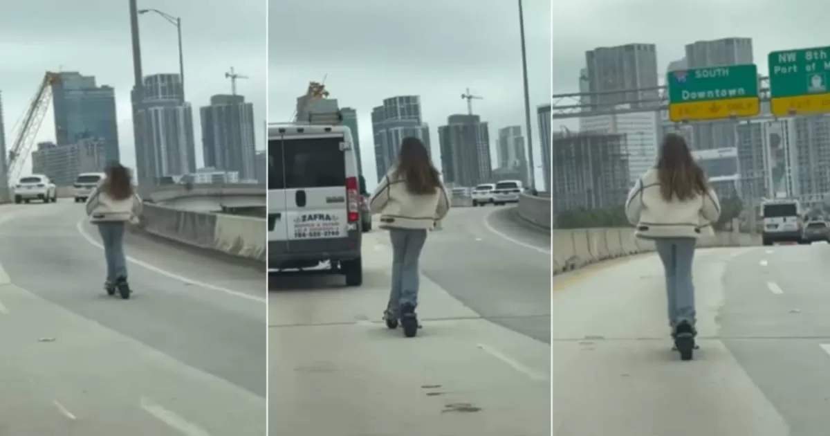 Woman rides electric scooter on Miami highway
