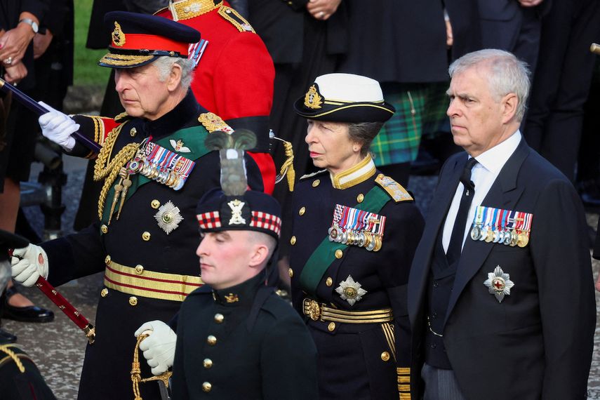 Britain's King Charles III (L), Britain's Princess Anne, the Princess Royal (C) and Britain's Prince Andrew, Duke of York walk behind the procession of Queen Elizabeth II's coffin, from the Palace of Holyroodhouse to St Giles Cathedral on the Royal Mile on September 12, 2022, where Queen Elizabeth II will be laid to rest. 