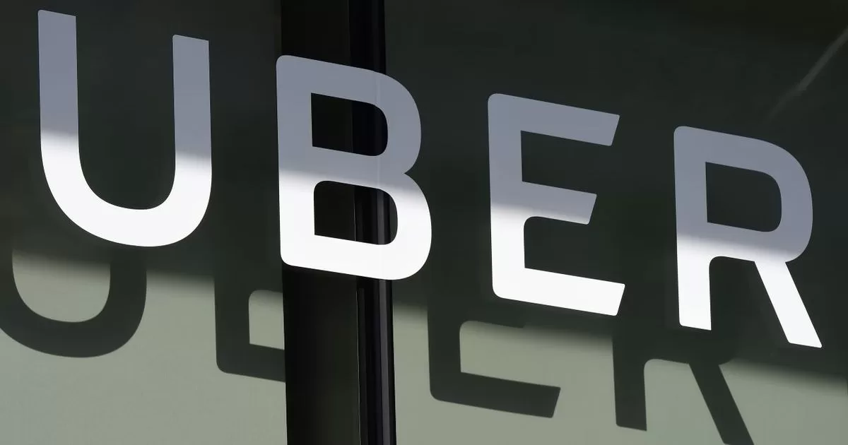 Uber reports its first annual net profit since going public
