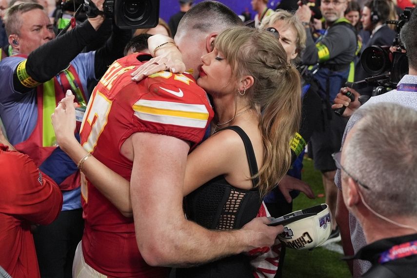 Taylor Swift hugs Kansas City Chiefs tight end Travis Kelce (87) after NFL Super Bowl 58 against the San Francisco 49ers on Sunday, Feb. 11, 2024, in Las Vegas.  The Chiefs won 25-22.