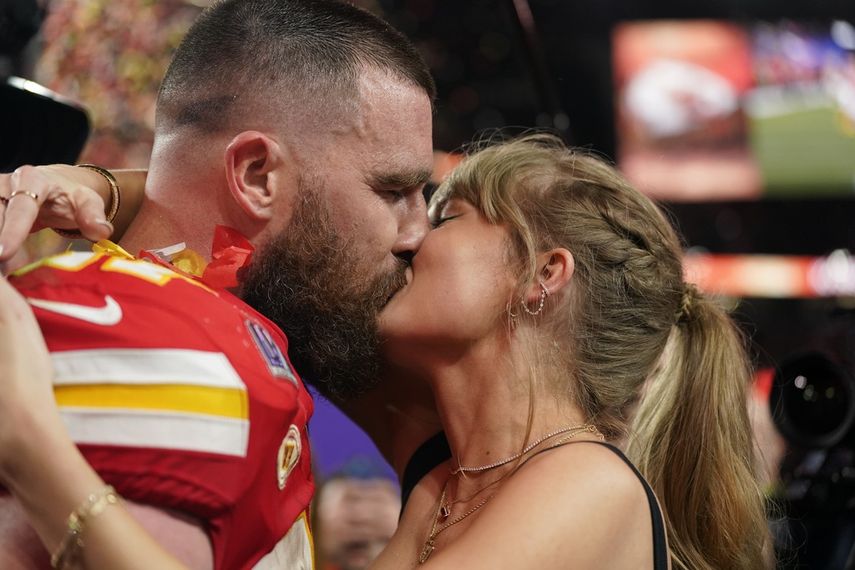 Taylor Swift kisses Kansas City Chiefs tight end Travis Kelce after the victory against the San Francisco 49ers in Super Bowl 58, Sunday, February 11, 2024, in Las Vegas. 