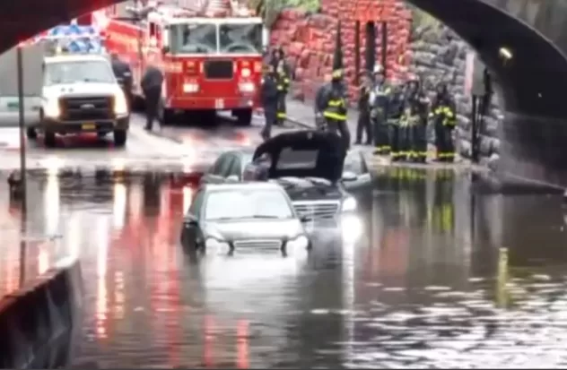 At least three people rescued from submerged cars

