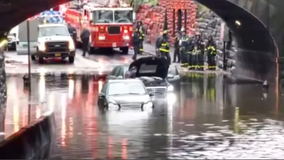 At least three people rescued from submerged cars
