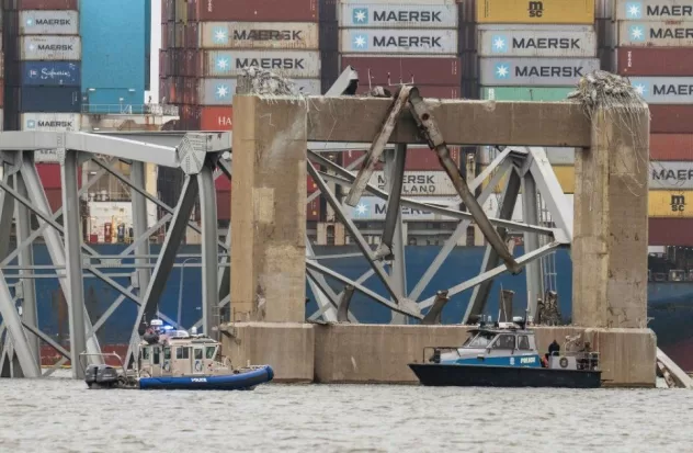 Barges move cranes to Baltimore to remove twisted remains from bridge