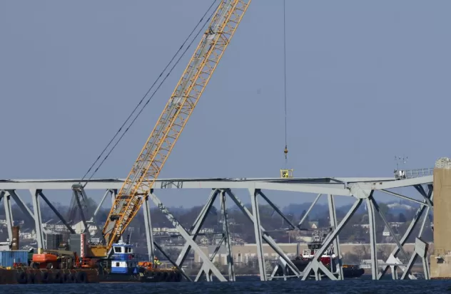 Crews begin removing pieces of collapsed bridge in Baltimore