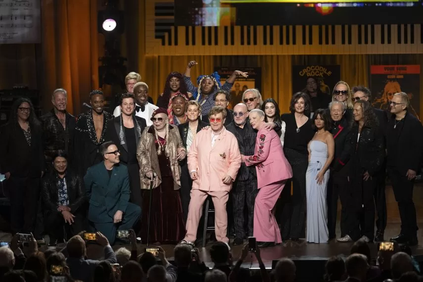 Library of Congress 2024 Gershwin Prize for Popular Song recipients Elton John and Bernie Taupin surrounded by artists performing at the tribute concert at DAR Constitution Hall on Wednesday, March 20, 2024, in Washington.