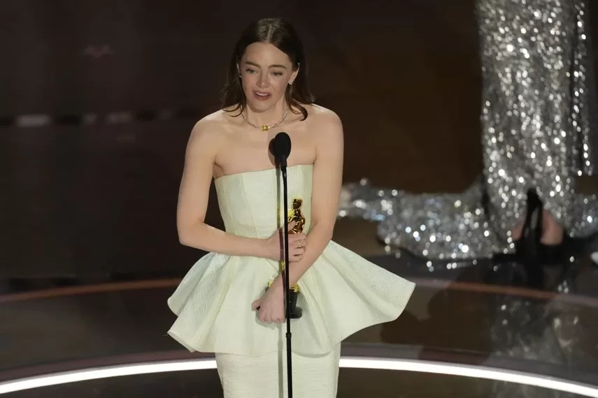 Emma Stone accepts the award for Best Actress for her lead role in Poor Things during the Oscars ceremony on March 10, 2024, at the Dolby Theater in Los Angeles.
