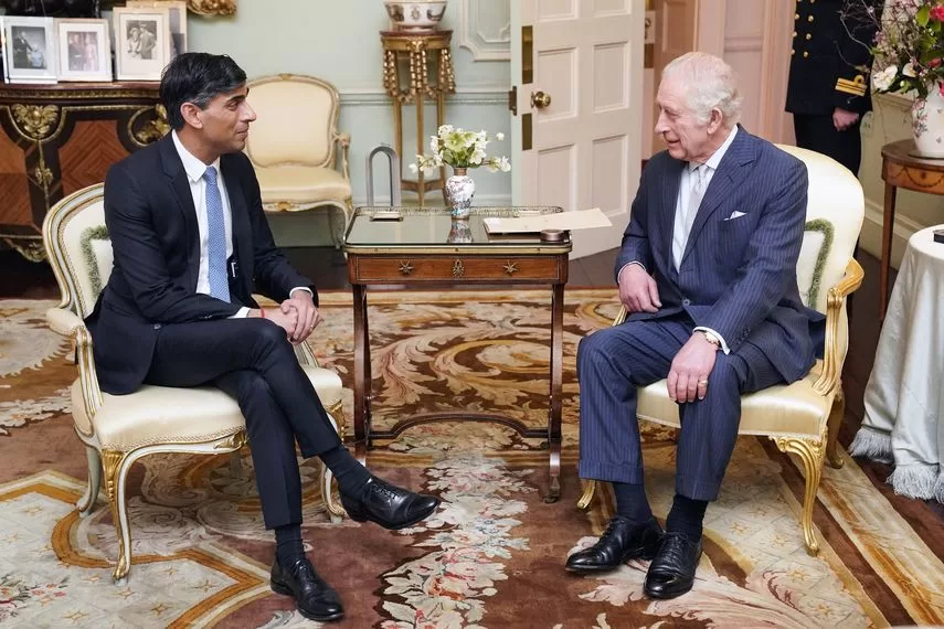 Britain's King Charles III speaks with British Prime Minister Rishi Sunak at Buckingham Palace, central London, on February 21, 2024 for his first in-person audience since the monarch's cancer diagnosis.