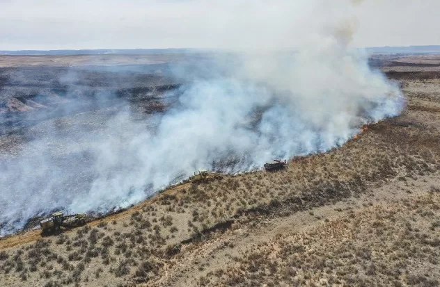 Texas struggles to contain fires as strong winds threaten
