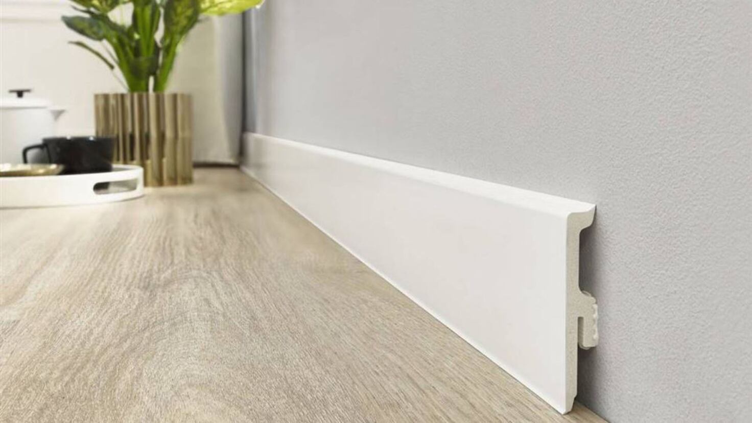 Why are skirting boards used in houses and homes in Spain and what is their function?
