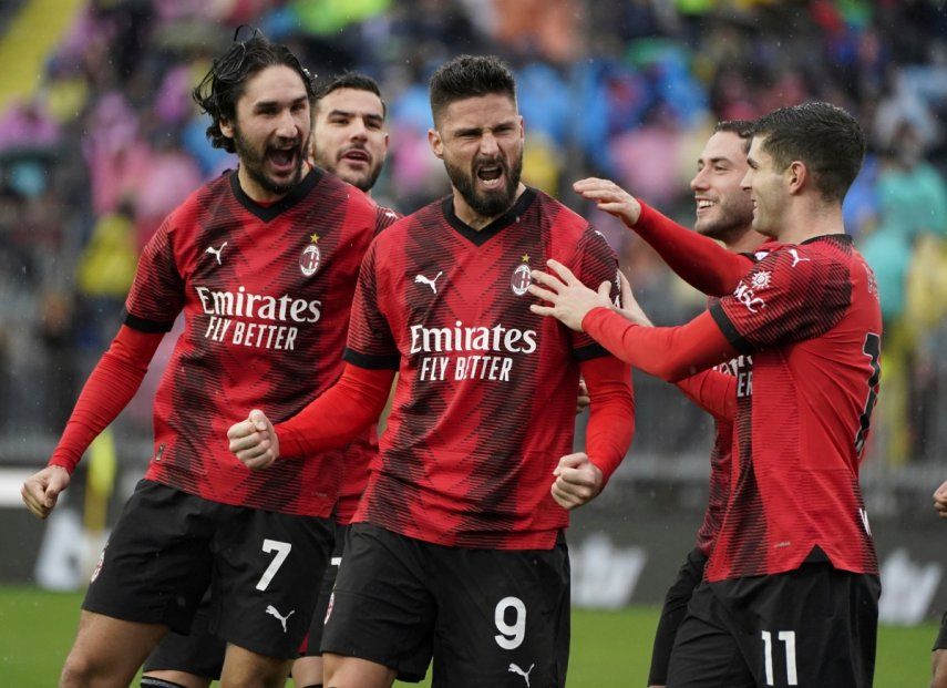 Olivier Giroud of AC Milan celebrates after scoring his team's second goal in their Serie A match against Empoli on Sunday, January 7, 2024. 