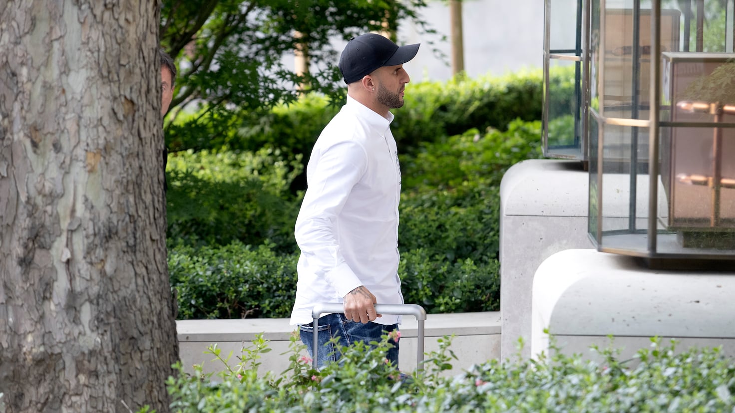 Manchester City star Kyle Walker returns home after his double life comes to light
