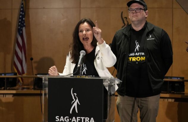 SAG-AFTRA President Fran Drescher, left, and SAG-AFTRA National Executive Director and Chief Negotiator Duncan Crabtree-Ireland speak during a press conference announcing a Screen Actors Guild strike -American Federation of Radio and Television Artists on Thursday, July 13, 2023, in Los Angeles.  This is the first time since 1960 that Hollywood actors and screenwriters are on strike at the same time.