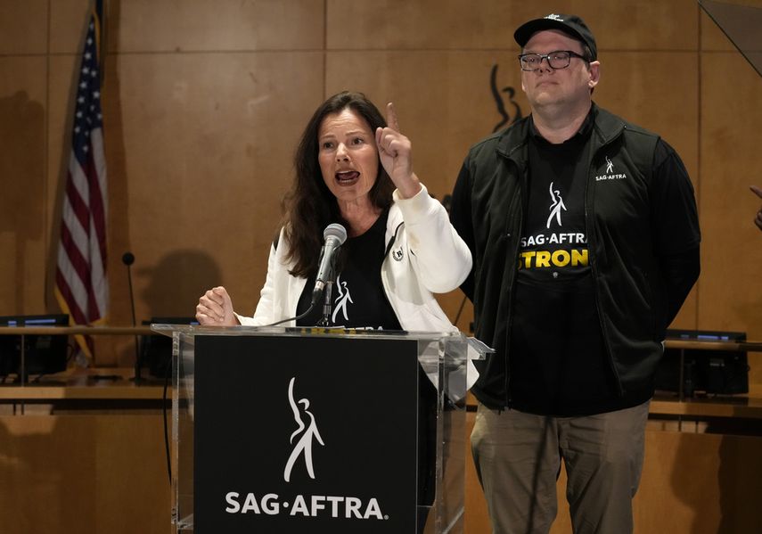 SAG-AFTRA President Fran Drescher, left, and SAG-AFTRA National Executive Director and Chief Negotiator Duncan Crabtree-Ireland speak during a press conference announcing a Screen Actors Guild strike -American Federation of Radio and Television Artists on Thursday, July 13, 2023, in Los Angeles.  This is the first time since 1960 that Hollywood actors and screenwriters are on strike at the same time.
