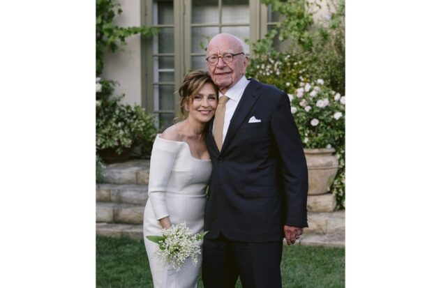 This image provided by News Corp. shows tycoon Rupert Murdoch and molecular biologist Elena Zhukova posing for a photo on Saturday, June 1, 2024, during their wedding at his vineyard in Bel Air, California.