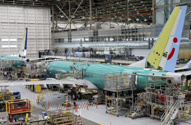 Boeing reports losses of more than $1.4 billion and names new CEO

