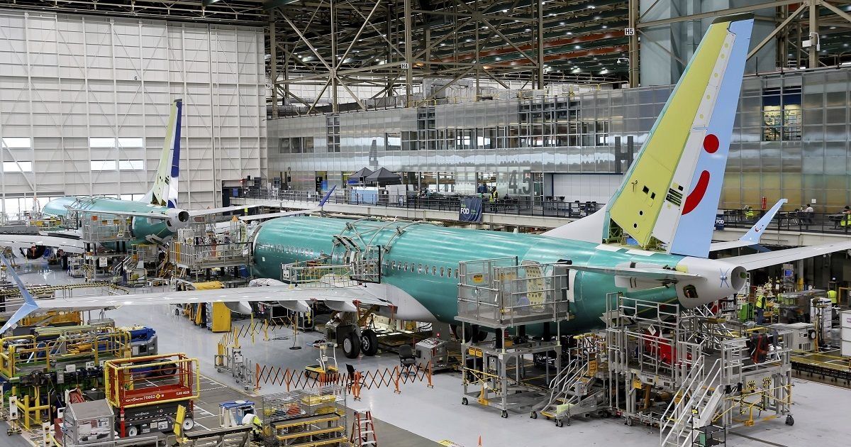 Boeing reports losses of more than $1.4 billion and names new CEO