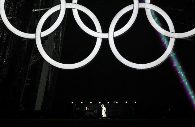 Celine Dion dazzles from the Eiffel Tower at the Olympic Games
