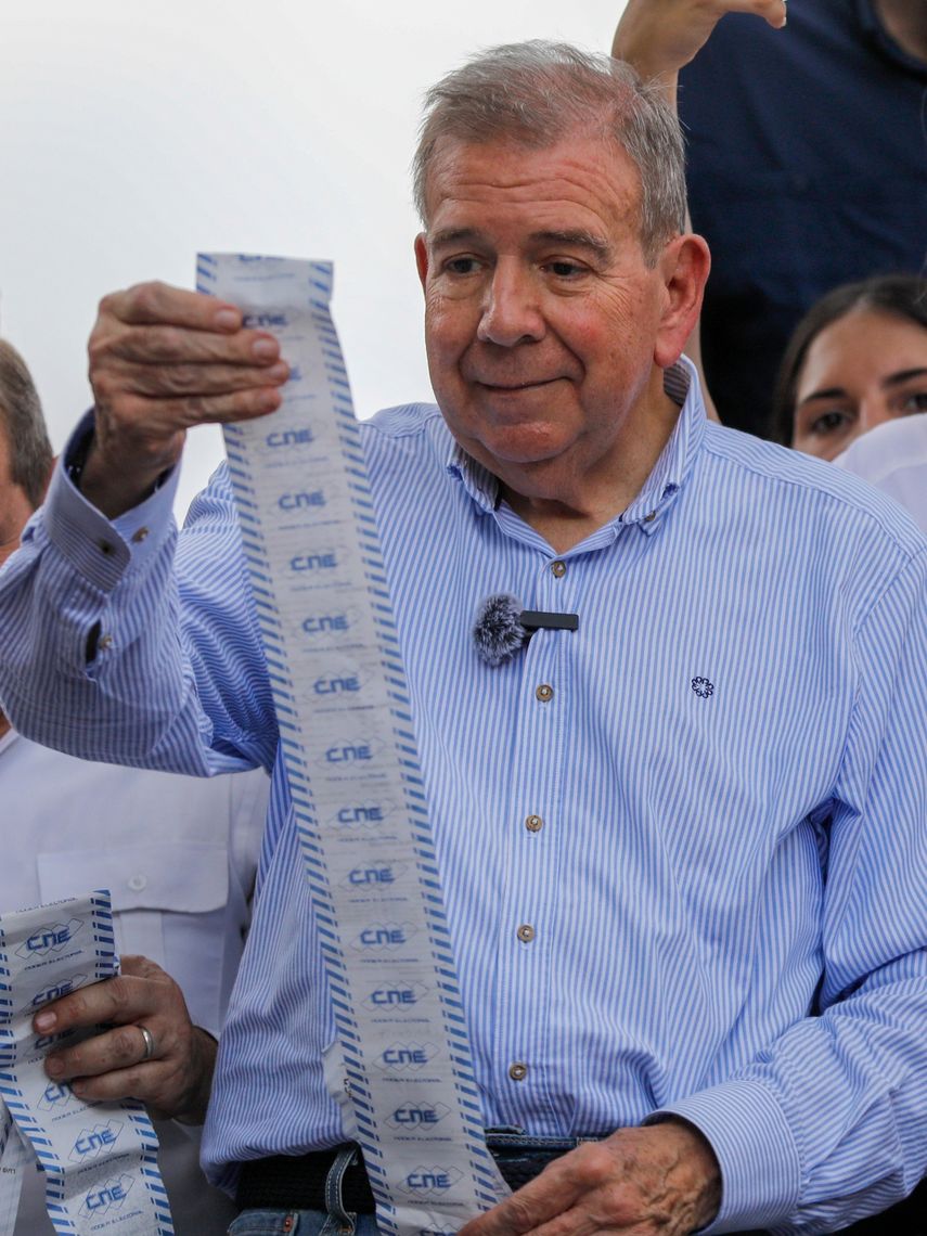 Opposition candidate Edmundo Gonzalez holds voting records from atop a truck during a protest against the official results of the presidential election that declared dictator Nicolas Maduro the winner in Caracas, Venezuela, Tuesday, July 30, 2024.